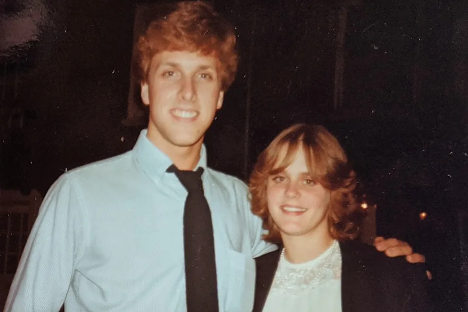 Eric in a shirt and tie with a friend at an evening event at Exeter.